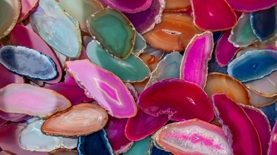 Close up view of many colorful Agate crystal slices up for sale.